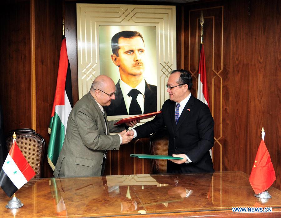 SYRIA-DAMASCUS-CHINA-HUMANITARIAN-AID-AGREEMENT