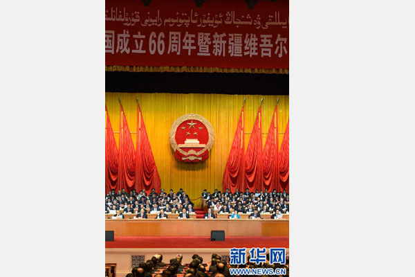 10月1日，慶祝中華人民共和國成立66周年暨新疆維吾爾自治區(qū)成立60周年大會(huì)在新疆人民會(huì)堂隆重舉行。 新華社記者 高潔 攝 