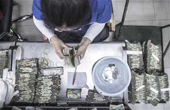 &ldquo;無現(xiàn)金&rdquo;進程中的公交點鈔員